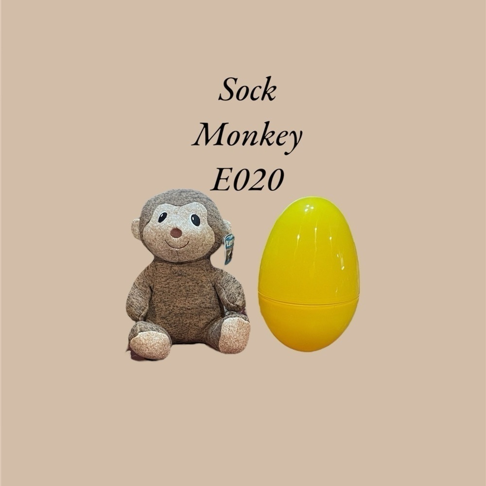 E020 SOCK MONKEY HATCHLING.  12” SOCK MONKEY IN A 12” EGG
